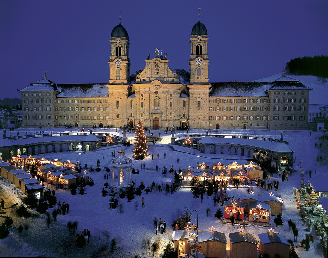 Christmas market in front of the Benedictine monastery in Einsiedeln, Canton Schwyz, Switzerland