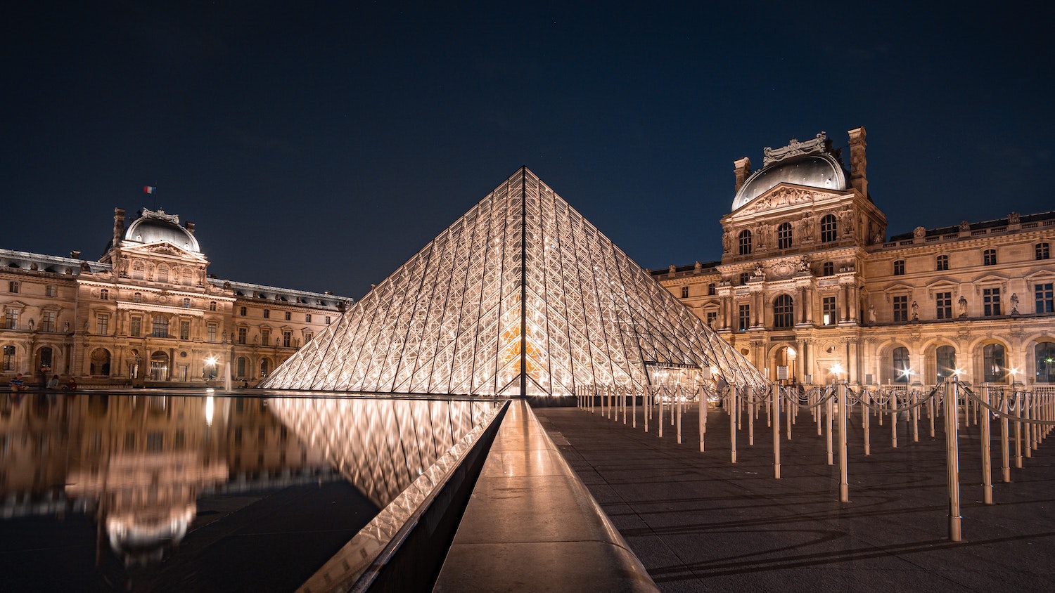 Musee de Louvre at night_Image by Michael-Fousert Unsplash