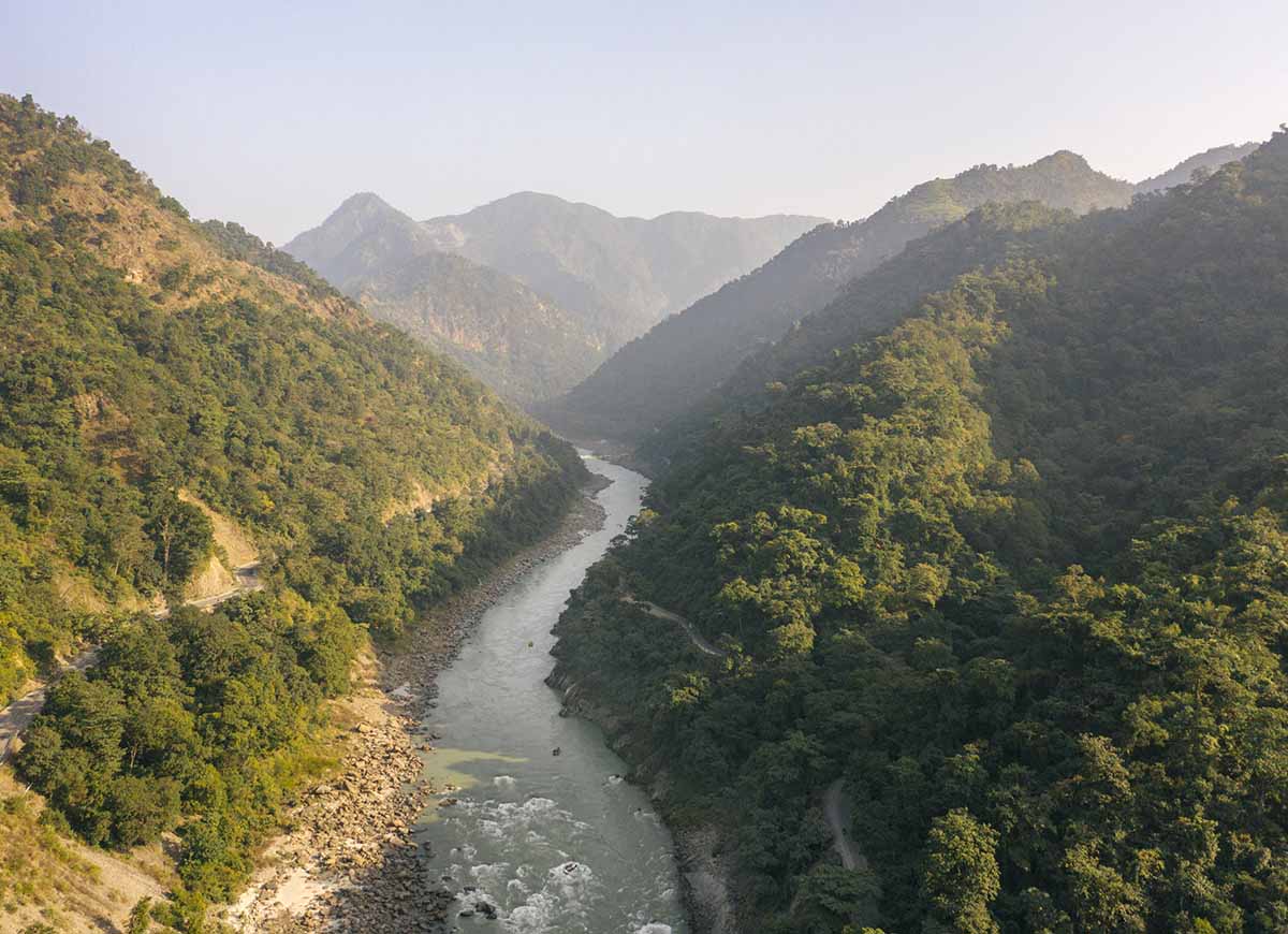 The Ganges River flowing through the Himalayan Foothills