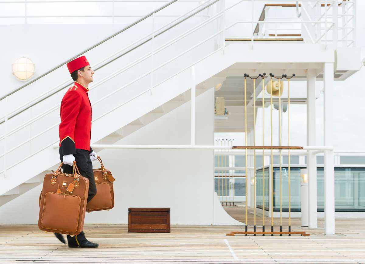 Cunard Bell Boy carrying luggage